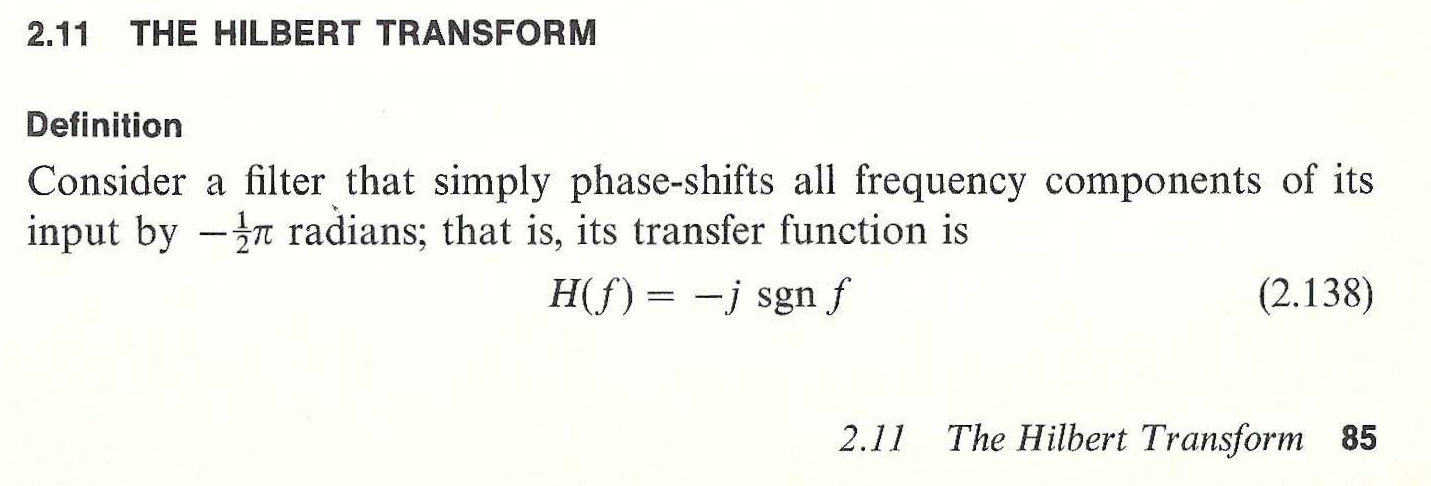 Image from an old engineering textbook that states in bold font at top 2.11 The Hilbert Transform. The next line says Definition, followed by the paragraph Consider a filter that simply phase-shifts all frequency components of its input by -pi over 2 radians; that is, its transfer function is H(f) = -j sgn f. To the right of this text it states (2.138). The bottom shows in italics 2.11 The Hilbert Transform and the page number 85.